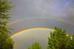 Stock photo of a double rainbow during a thunder storm in the city of Regina, Saskatchewan, Canada.