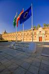 Stock photo of three flags outside the Parlamento de Andalvcia (Andalusian Regional Parliament). The Hospital de las Cinco Llagas was once housed in this building, in the Macarena District, City of Sevilla (Seville), Province of Sevilla, Andalusia (Andalu