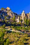 Stock photo of the Ruins of Castell de Guadalest, Castle of Guadalest, and the white washed church belfry in the town of Guadalest, Costa Blanca, Province of Alicante, Comunidad Valenciana, Spain, Europe.