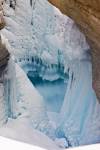 Stock photo of ice formations of the Mistaya River, Mistaya Canyon during winter after fresh snowfall, Icefields Parkway, Banff National Park, Canadian Rocky Mountains, Alberta, Canada.