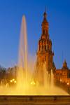 Stock photo of the tower and fountain at the Plaza de Espana, Parque Maria Luisa, during dusk in the City of Sevilla (Seville), Province of Sevilla, Andalusia (Andalucia), Spain, Europe.