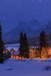 Stock photo of a winter night scene at the Post Hotel located on the snow covered banks of the Pipestone River, Lake Louise, Banff National Park, Canadian Rocky Mountains, Alberta, Canada.