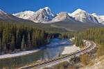 Stock photo of railway tracks at Morant's Curve alongside the Bow River, Bow Valley Parkway, Banff National Park, Alberta, Canada. Banff National Park forms part of the Canadian Rocky Mountain Parks, UNESCO World Heritage Site.