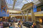 Stock photo of a shopping day at the mall with several people walking to shops at the Cornwall Centre, City of Regina, Saskatchewan, Canada.