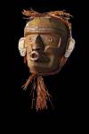 Stock photo of Wild Woman (Dzunukwa), a Native Mask by Stan C. Hunt carved from red cedar. This mask of Dzunukwa or Wildwomen of the woods has been Masterfully carved from red cedar, cedar bark rope this mask has been knife finished. It measures 11 inches