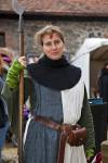 Stock photo of Woman dressed in medieval guard clothing during the medieval markets on the grounds of Burg Ronneburg (Burgmuseum), Ronneburg Castle, Ronneburg, Hessen, Germany, Europe.