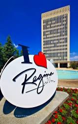 City Hall building, fountain, sign in Queen Elizabeth II Court City of Regina Saskatchewan Canada