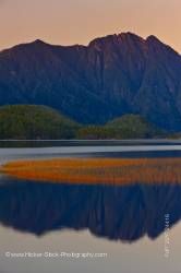 Mountain reflections Clayoquot Arm of Kennedy Lake Clayoquot Sound Vancouver Island British Columbia