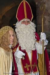 Christmas scene costumed santa man angle woman