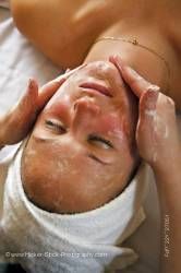 Woman receiving facial massage Black Bear Resort Spa Wellness Port McNeill
