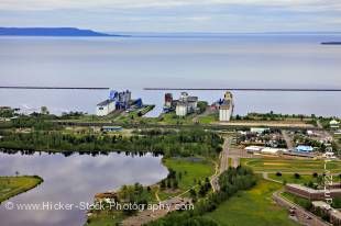 Stock photo aerial view showing Boulevard Lake in the Current River Greenway and Grain Elevators lining the waterfront of Lake Superior in the City of Thunder Bay, Ontario, Canada.