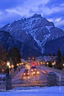 Stock photo of Banff Avenue at night with Cascade Mountain in the background as viewed from the grounds of the Parks Canada Administration Building in the Town of Banff in Banff National Park, Canadian Rocky Mountains, Alberta, Canada.