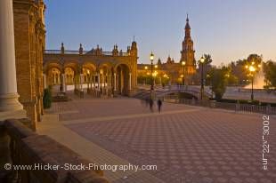 Stock photo of the tower, bridge and fountain seen from the central building at the Plaza de Espana, Parque Maria Luisa, during dusk in the City of Sevilla (Seville), Province of Sevilla, Andalusia (Andalucia), Spain, Europe.