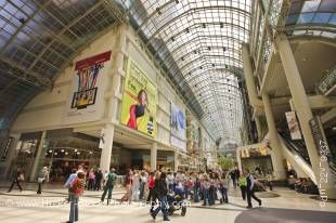 Stock photo of the busy interior of the Eaton Centre shopping complex in downtown Toronto in Ontario, Canada.