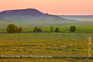 Stock photo of the large, open farmland in the Big Muddy Badlands at sunset, Southern Saskatchewan, Canada.