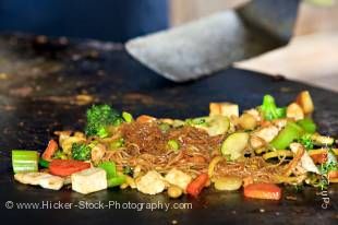Stock photo of the food on the large grill as it is prepared at the Mongolie Grill World Famous Stirfry Restaurant in Whistler Village, British Columbia, Canada. Property Released.
