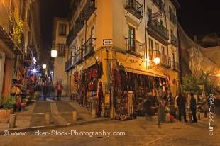 This stock photo shows the souvenir shops lining Calle Caldereria Nueva at night in the City of Granada, Province of Granada, Andalusia (Andalucia), Spain, Europe.