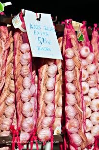 Stock photo of Garlic hanging outside a store along the road to the town of Guadalest, Costa Blanca, Province of Alicante, Comunidad Valenciana, Spain, Europe.