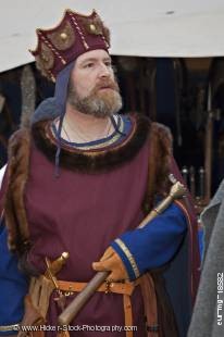 Stock photo of man dressed in medieval clothing during the medieval markets on the grounds of Burg Ronneburg (Burgmuseum), Ronneburg Castle, Ronneburg, Hessen, Germany, Europe.