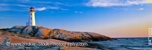Stock photo of panoramic photo of Peggy's Cove Lighthouse and rock formations during sunset in Nova Scotia, Canada.