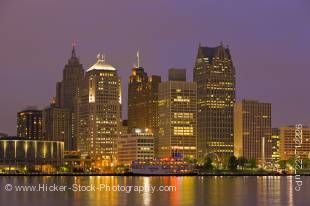 Stock photo of the lighted skyline at night of Detroit city, Michigan, USA seen from the waterfront in the city of Windsor, Ontario, Canada.