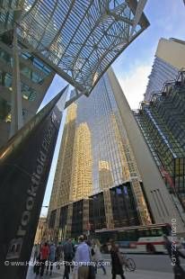 Stock photo of high rise buildings, architectural detail, people, and blue sky outside Brookfield Place in the Financial District of downtown Toronto.