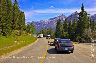 Stock photo of cars and campers at a stop to view the Bighorn sheep in Banff National Park, Alberta, Canada.