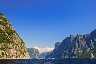 Stock photo of the Western Brook Pond seen from a tour boat leading to a beautiful mountain range, Gros Morne National Park, UNESCO World Heritage Site, Viking Trail, Trails to the Vikings, Highway 430, Northern Peninsula, Great Northern Peninsula, Newfou
