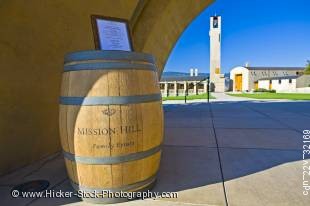 Stock photo of wine barrel and sign at the entrance to Mission Hill Family Estate Winery, Westbank, West Kelowna, Kelowna, Okanagan, British Columbia, Canada.