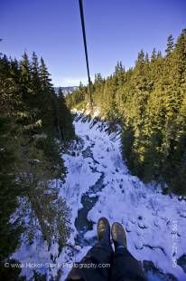 Stock photo of the view from the zipline over the Fitzsimmons Creek between Whistler and Blackcomb Mountains, Ziptrek Ecotours, zipline touring and canopy walk adventures, Whistler, British Columbia, Canada.