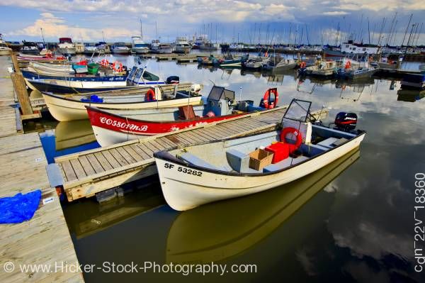 Stock photo of Fishing boats Main Dock Boat Harbour shores of Lake Winnipeg in the town of Gimli Manitoba Canada