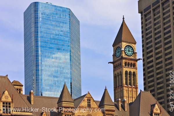 Stock photo of Old City Hall Clock Tower Blue Sky and Modern Buildings Downtown Toronto Ontario Canada