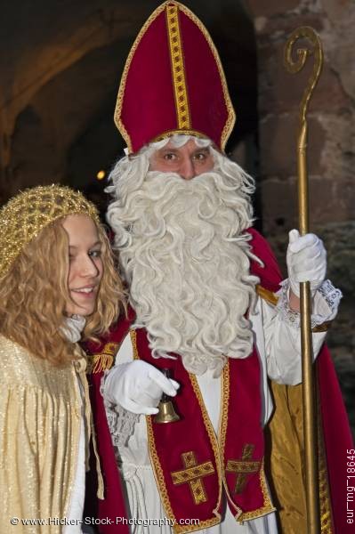 Stock photo of Christmas scene costumed santa man angle woman